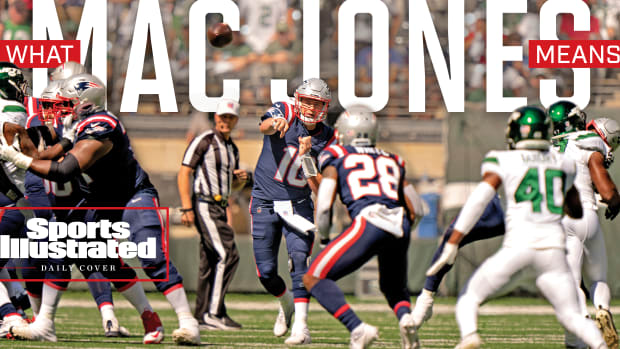 Mac Jones throws a pass against in a game against the Jets